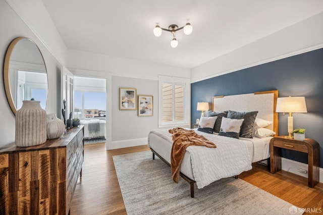 1371-1373 16th Ave, San Francisco, CA 94122 - bedroom with baseboards and wood finished floors
