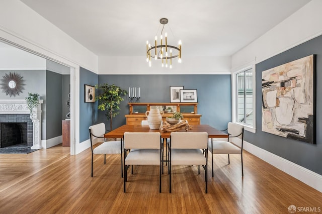 1371-1373 16th Ave, San Francisco, CA 94122 - dining room featuring wood finished floors, a fireplace with flush hearth, and a chandelier