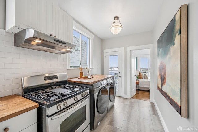 1371-1373 16th Ave, San Francisco, CA 94122 - kitchen with stainless steel range with gas cooktop, butcher block counters, under cabinet range hood, decorative backsplash, and white cabinetry