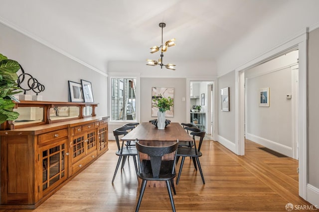 1371-1373 16th Ave, San Francisco, CA 94122 - dining space featuring a chandelier and light wood-style floors