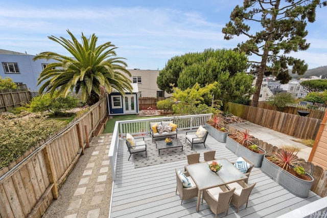 1371-1373 16th Ave, San Francisco, CA 94122 - wooden terrace featuring french doors, an outdoor hangout area, and a fenced backyard