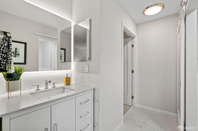 88 King St Unit 104, San Francisco, CA 94107 - bathroom with vanity, marble finish floor, and baseboards