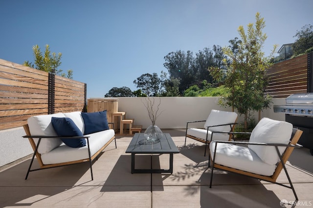 view of patio / terrace featuring fence and an outdoor hangout area