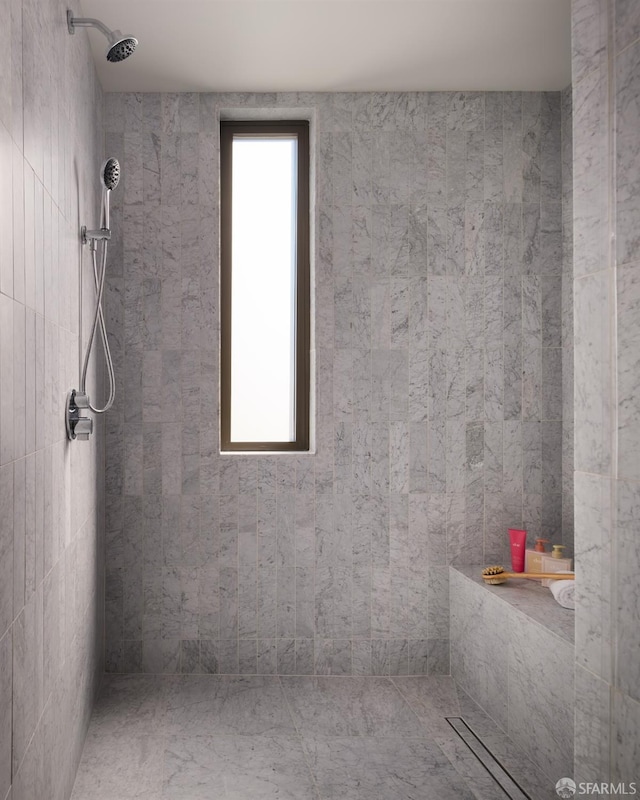 bathroom with tiled shower