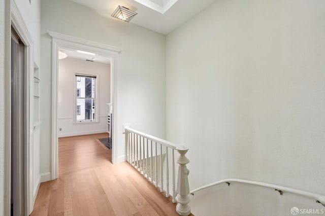 1695 Sutter St, San Francisco, CA 94109 - hall with an upstairs landing and light wood-style flooring