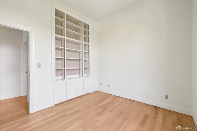 1695 Sutter St, San Francisco, CA 94109 - empty room with light wood-type flooring and baseboards