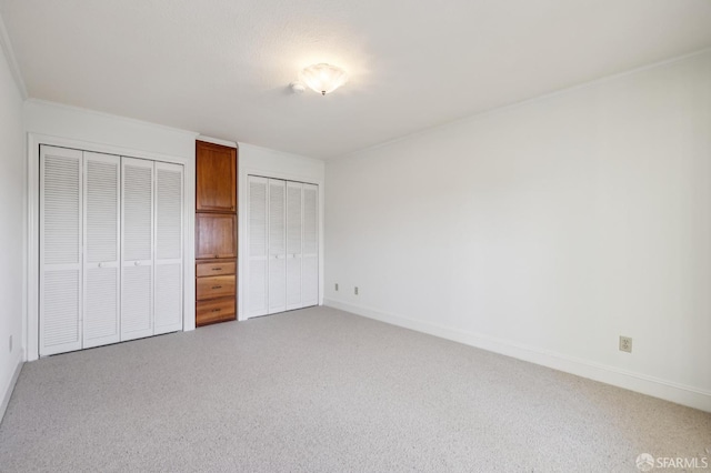 1695 Sutter St, San Francisco, CA 94109 - unfurnished bedroom with multiple closets and carpet floors