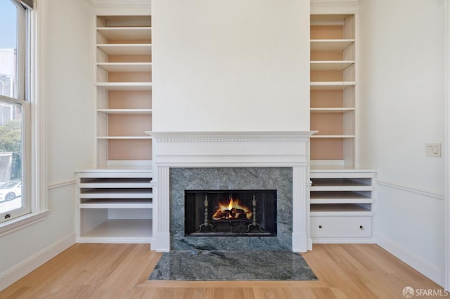 1695 Sutter St, San Francisco, CA 94109 - detailed view of wood finished floors, a high end fireplace, and built in features