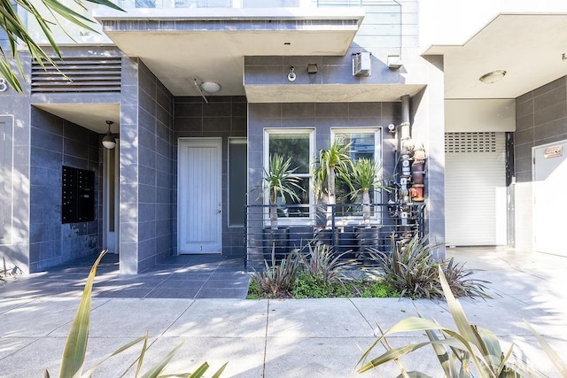 property entrance featuring concrete block siding
