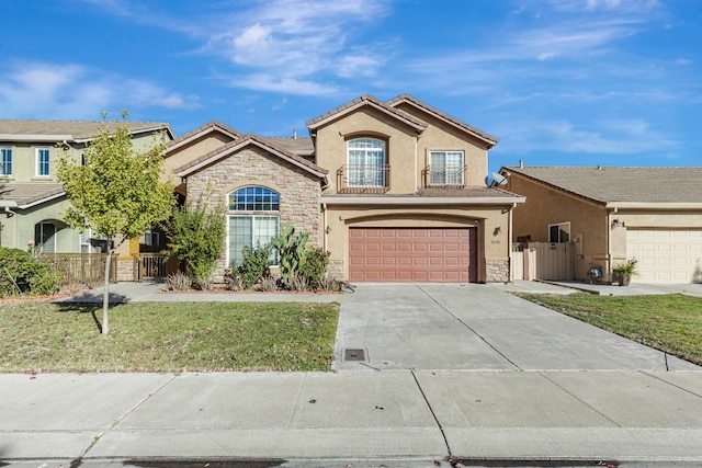 view of front of property featuring a front lawn and a garage