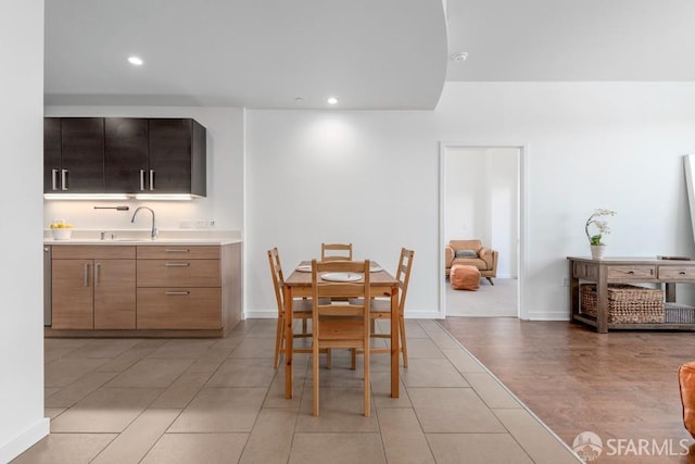 dining room with light tile patterned floors and sink