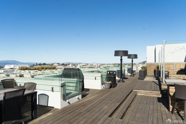 wooden deck featuring a mountain view