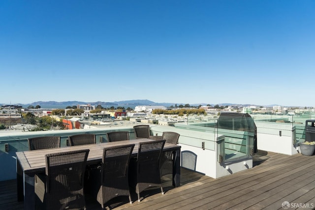 wooden deck featuring a mountain view