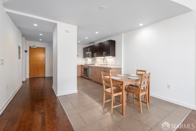 dining space with light wood-type flooring