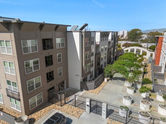 view of building exterior with fence