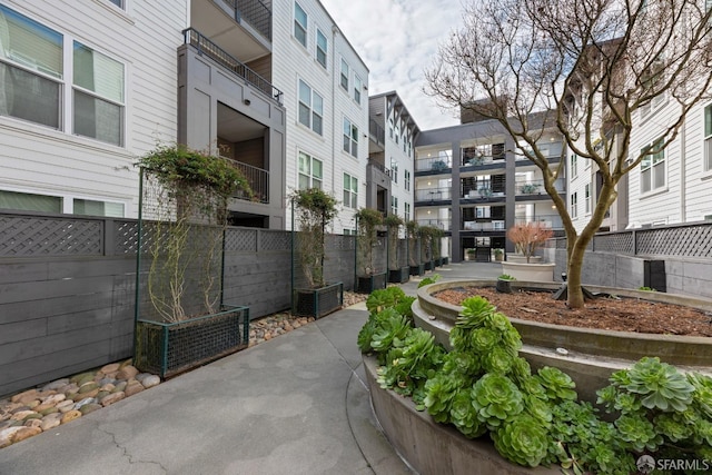 view of community with fence