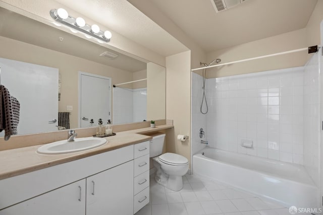 bathroom with vanity, visible vents, tile patterned flooring, bathing tub / shower combination, and toilet