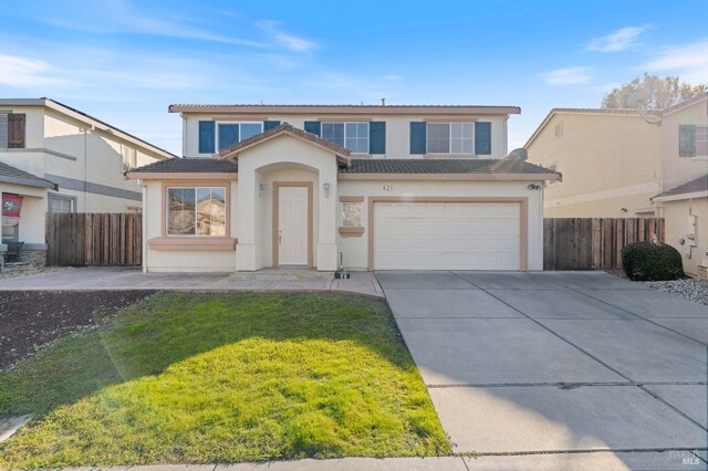 view of front property with a garage and a front lawn