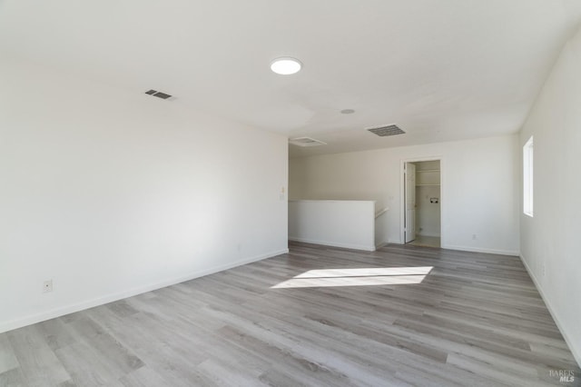 unfurnished room featuring light hardwood / wood-style flooring