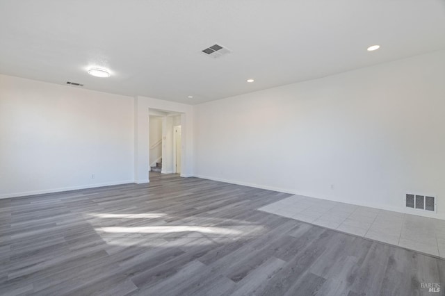 empty room with dark hardwood / wood-style floors