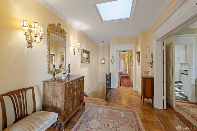 hallway featuring ornamental molding, parquet flooring, and a skylight