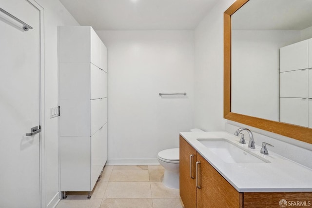 bathroom featuring vanity, toilet, and tile patterned floors