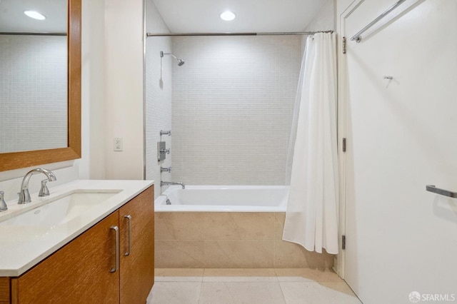 bathroom with vanity, shower / bathtub combination with curtain, and tile patterned floors