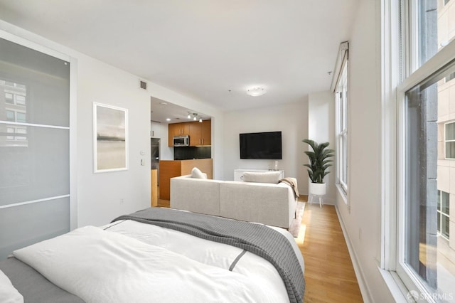 bedroom featuring light hardwood / wood-style floors