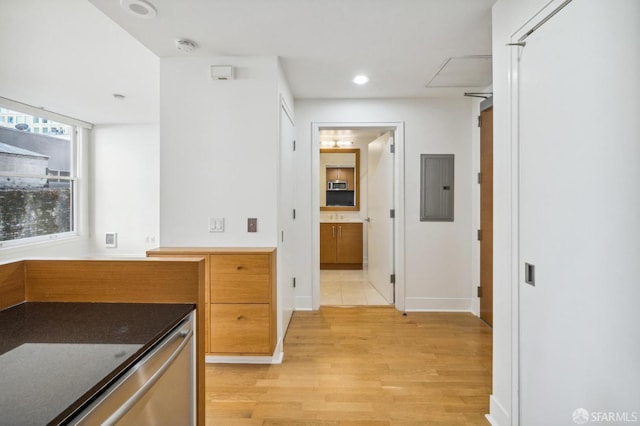 bathroom with electric panel and wood-type flooring