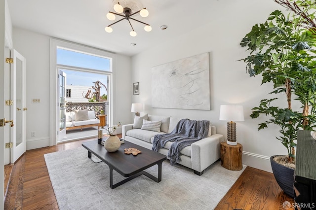 3364 21st St, San Francisco, CA 94110 - living room with a chandelier and wood finished floors