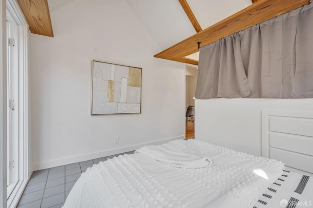 tiled bedroom featuring baseboards and lofted ceiling