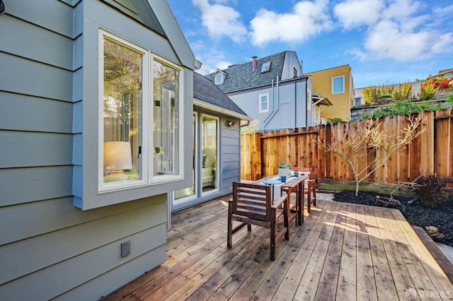 wooden deck featuring fence