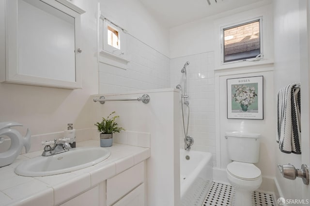 full bathroom featuring vanity,  shower combination, toilet, and tile patterned flooring