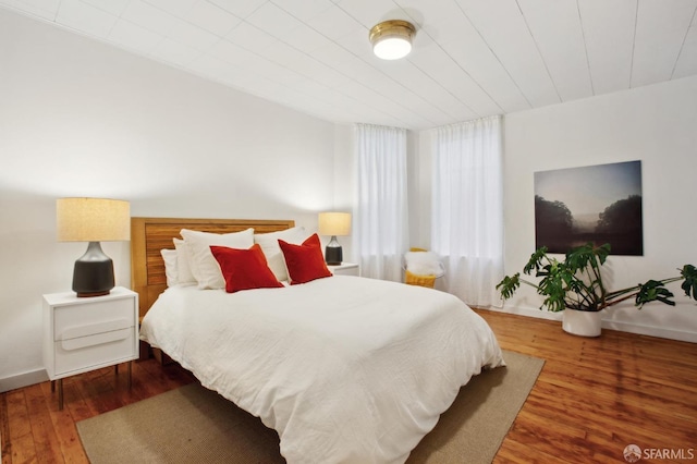 bedroom with wood-type flooring