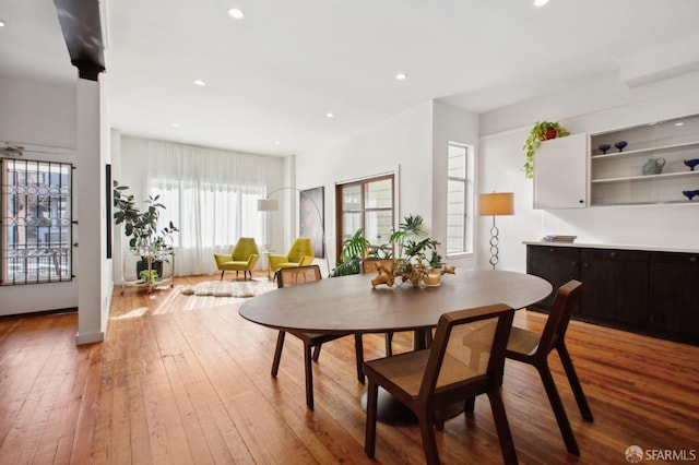 dining area with hardwood / wood-style flooring