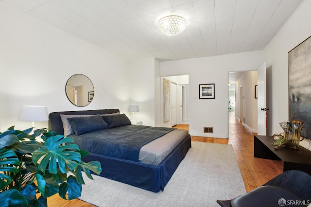 bedroom featuring wood-type flooring