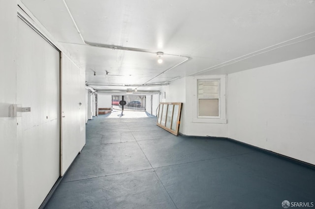 hallway with concrete flooring