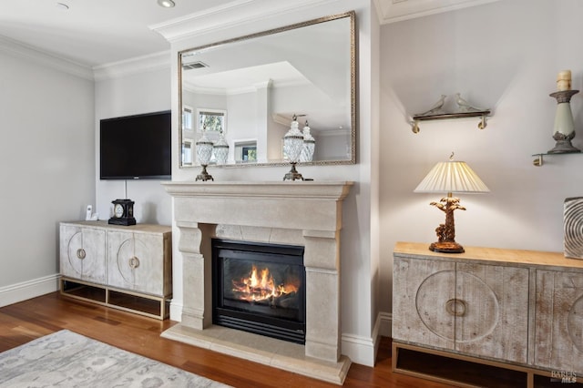 interior space with hardwood / wood-style flooring and ornamental molding