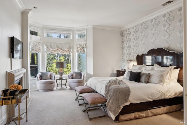 carpeted bedroom with ornamental molding