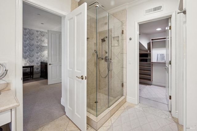 bathroom with an enclosed shower and ornamental molding