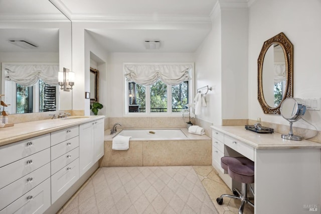 bathroom featuring tile patterned floors, tiled bath, plenty of natural light, and vanity