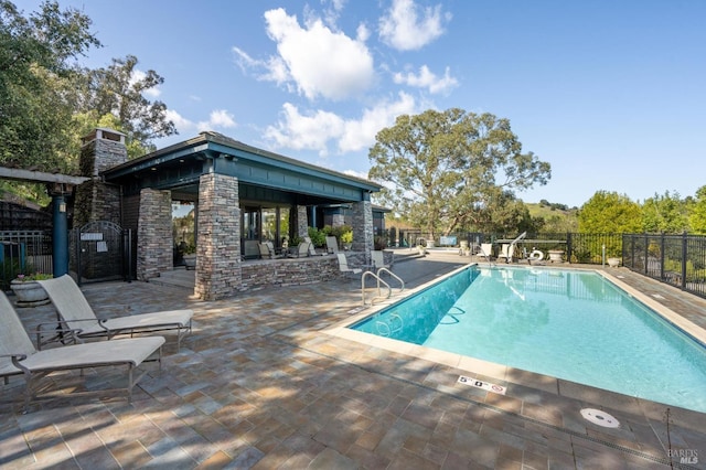 view of swimming pool featuring a patio area