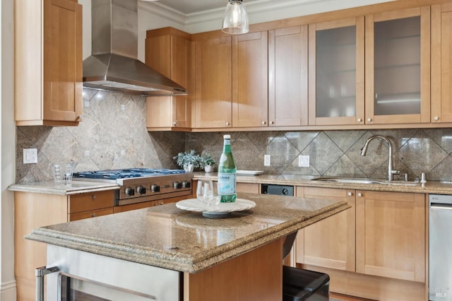 kitchen featuring sink, tasteful backsplash, ornamental molding, and wall chimney range hood