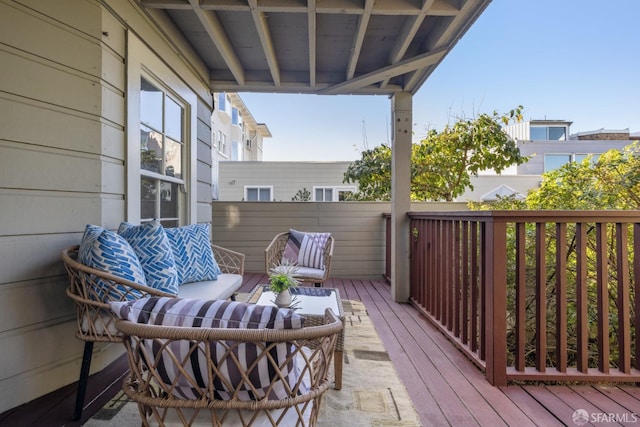 wooden deck with an outdoor hangout area