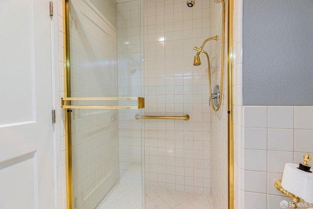 bathroom with a shower with shower door