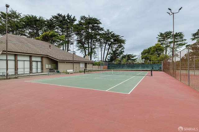 view of sport court with basketball hoop