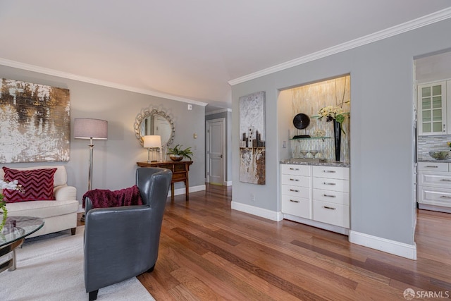 living room featuring ornamental molding and hardwood / wood-style floors