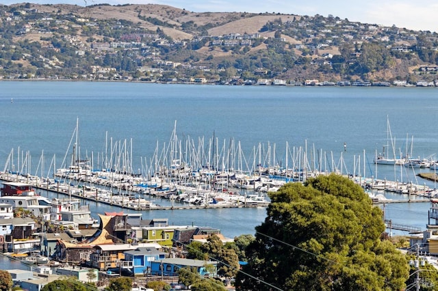 aerial view featuring a water and mountain view