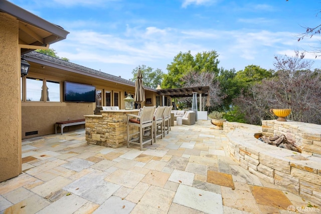 view of patio / terrace featuring outdoor dry bar