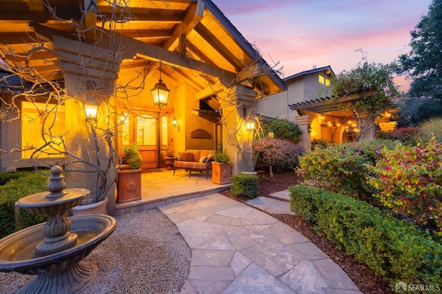 view of patio / terrace with outdoor lounge area and a pergola